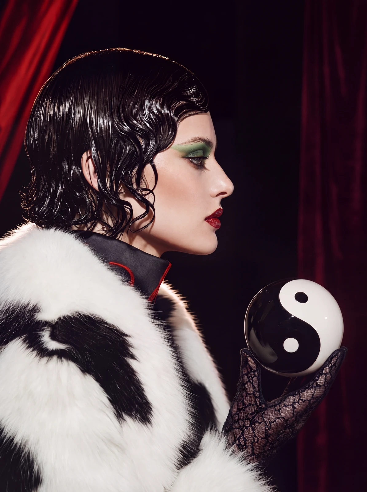 The yin-yang sphere held in the campaign photography — balance
